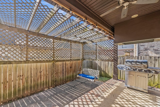 view of patio / terrace with ceiling fan, a grill, and a pergola