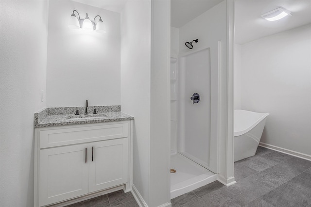 bathroom featuring vanity and separate shower and tub