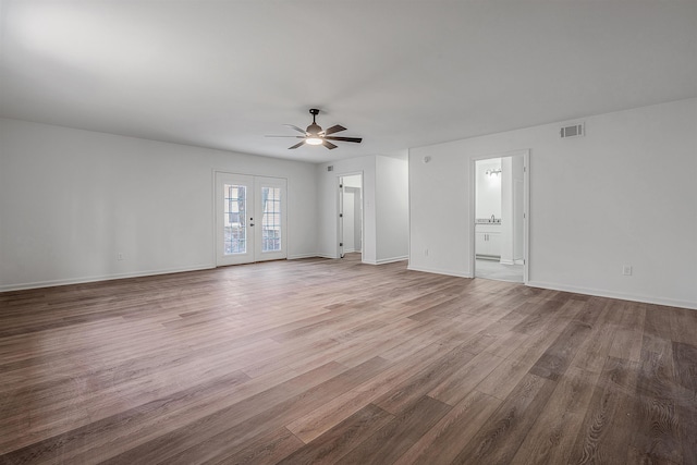 unfurnished living room featuring ceiling fan, light wood-type flooring, and french doors