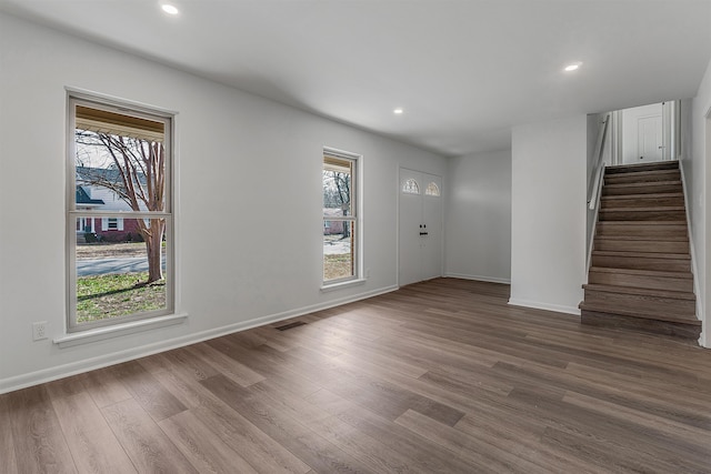 foyer with plenty of natural light and hardwood / wood-style floors