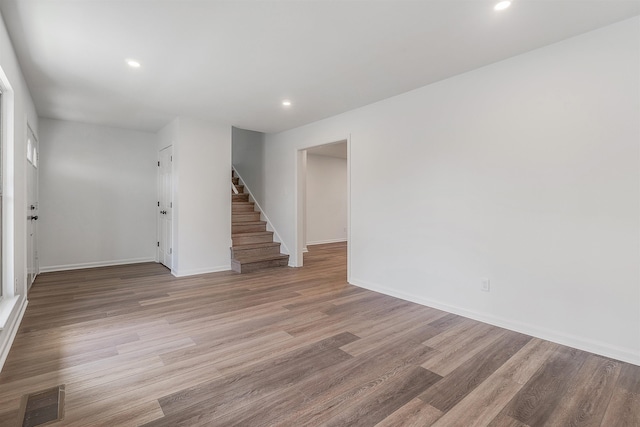 unfurnished room with light wood-type flooring