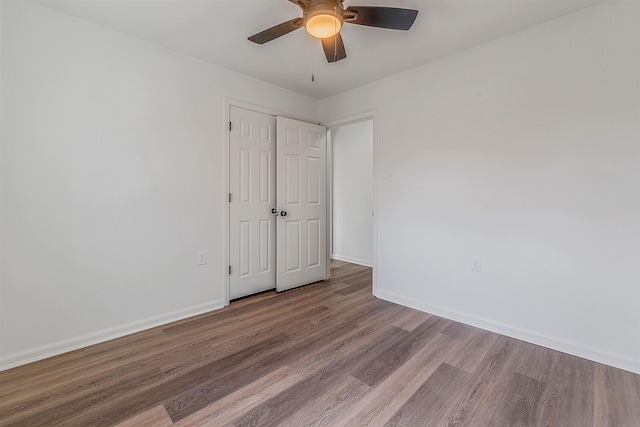 unfurnished room featuring hardwood / wood-style flooring and ceiling fan