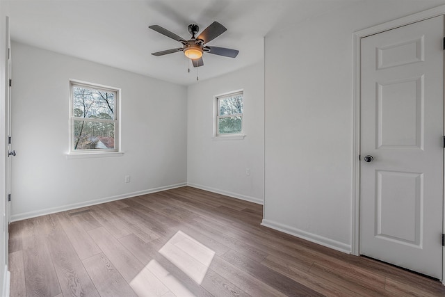 spare room with ceiling fan and light hardwood / wood-style floors