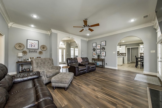 living room featuring french doors, ceiling fan, ornamental molding, and dark hardwood / wood-style floors