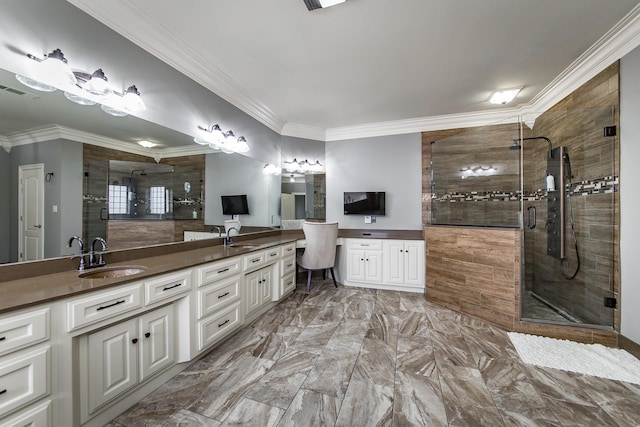 bathroom with ornamental molding, vanity, and an enclosed shower