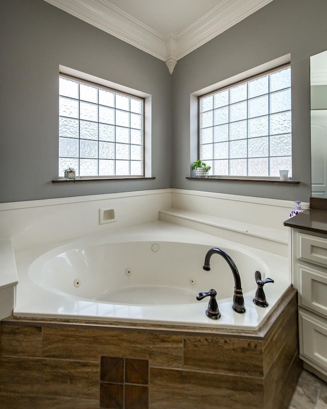 bathroom with vanity, crown molding, tiled bath, and a healthy amount of sunlight