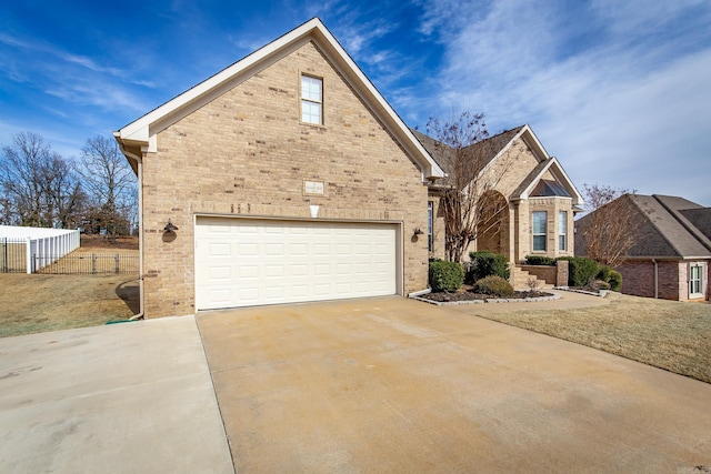 view of front property featuring a garage and a front yard