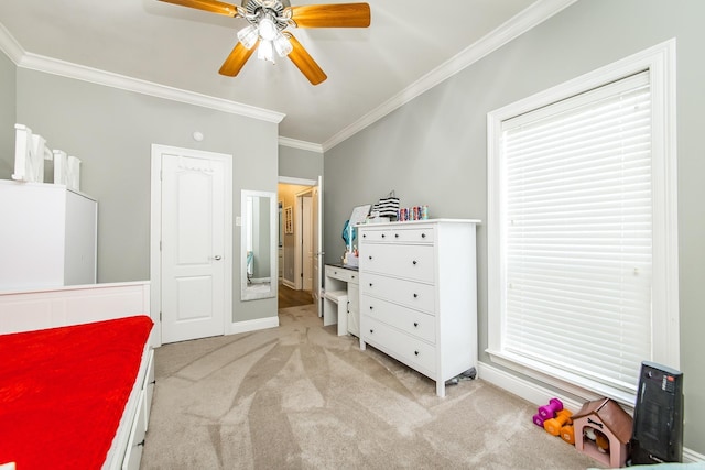 carpeted bedroom with crown molding and ceiling fan