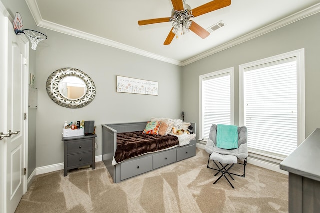 carpeted bedroom featuring ornamental molding and ceiling fan