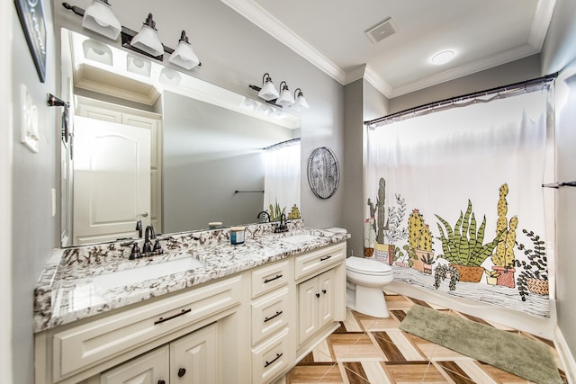 bathroom featuring vanity, ornamental molding, and toilet