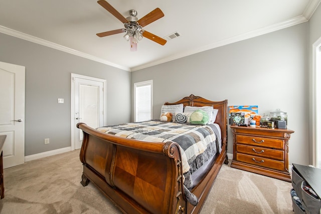 carpeted bedroom with ornamental molding and ceiling fan