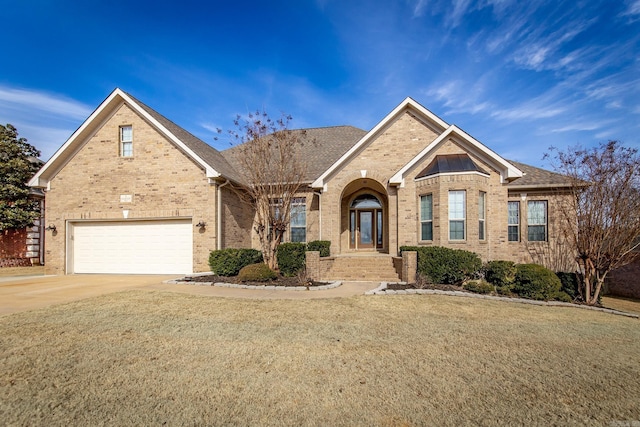 front of property featuring a garage and a front yard