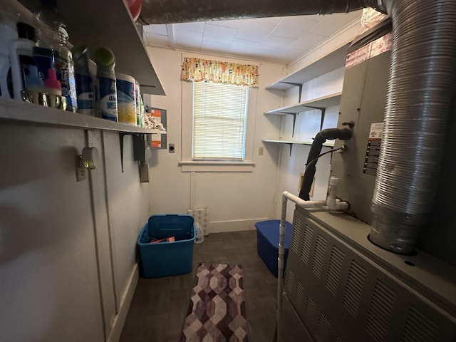 interior space with ornamental molding and heating unit