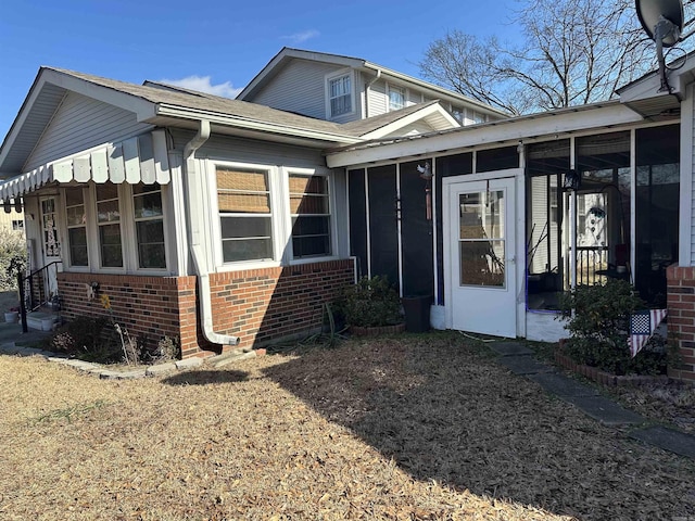 view of front of property featuring a sunroom