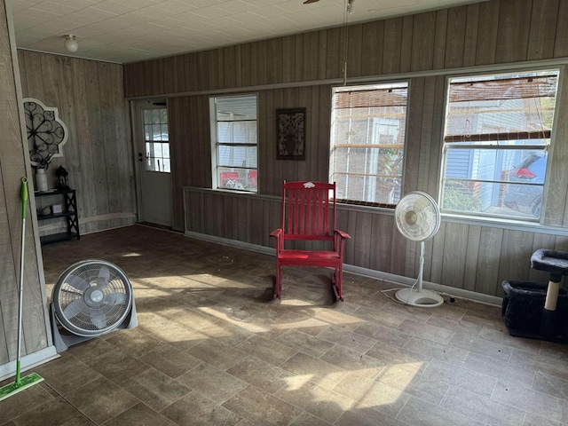 unfurnished room with wood walls