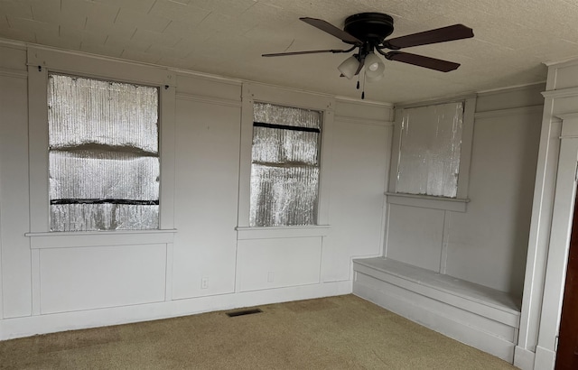 unfurnished room featuring carpet floors and ceiling fan