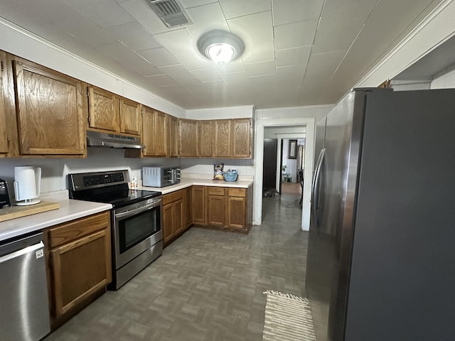 kitchen with dark parquet flooring and appliances with stainless steel finishes