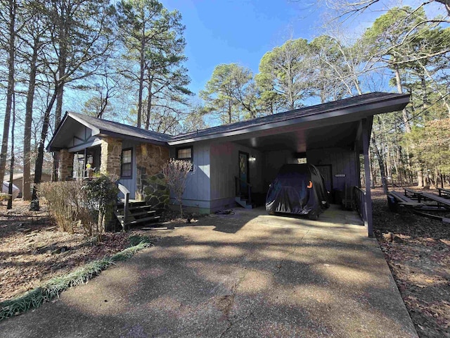 view of side of property featuring a carport