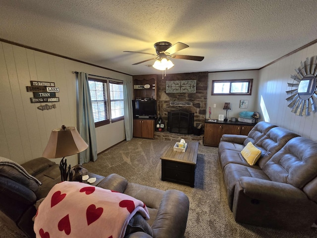 carpeted living room featuring a fireplace, plenty of natural light, and ornamental molding