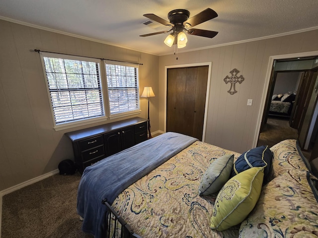 carpeted bedroom with crown molding, a closet, and ceiling fan