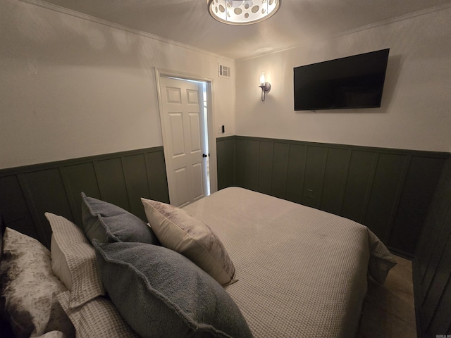 bedroom with crown molding