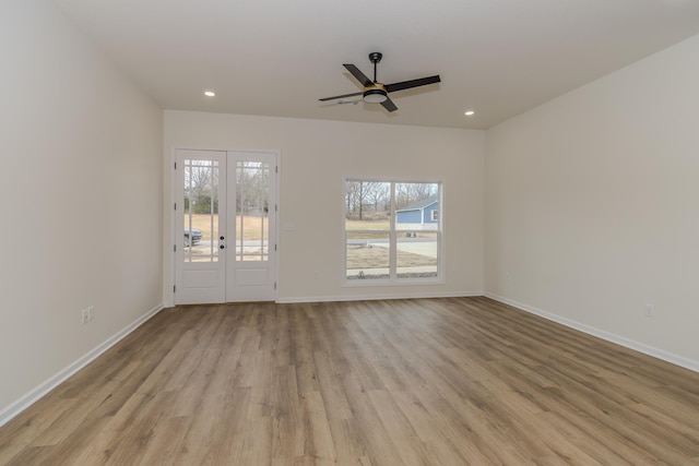 unfurnished living room with ceiling fan and light hardwood / wood-style flooring