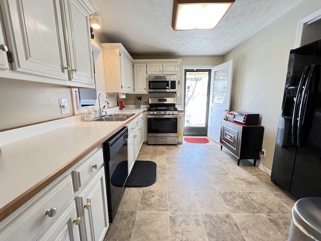 kitchen with white cabinetry, sink, a textured ceiling, and black appliances