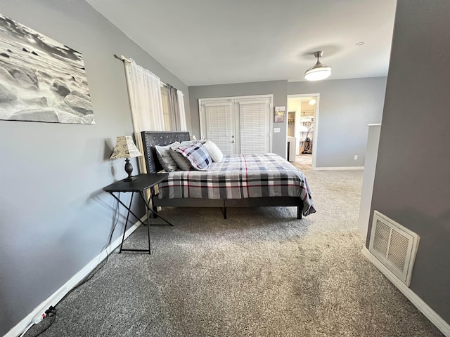 bedroom featuring carpet and a closet