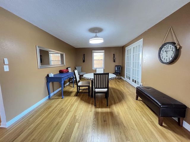 dining area with light wood-type flooring