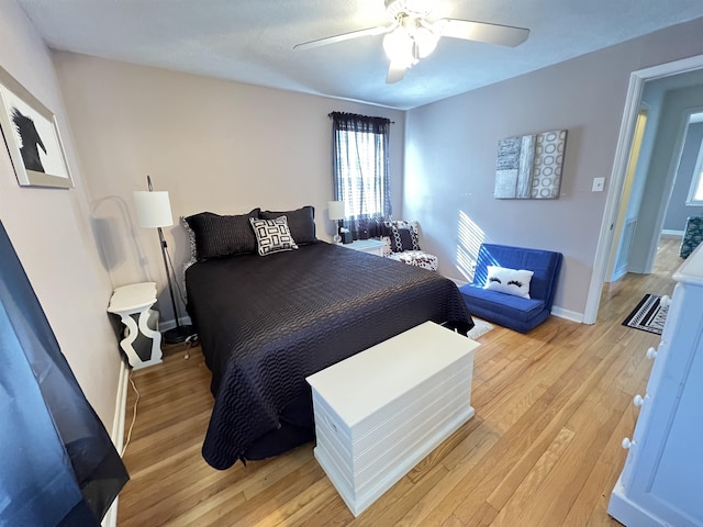 bedroom featuring light hardwood / wood-style flooring and ceiling fan