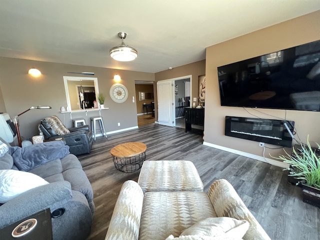 living room with dark hardwood / wood-style flooring