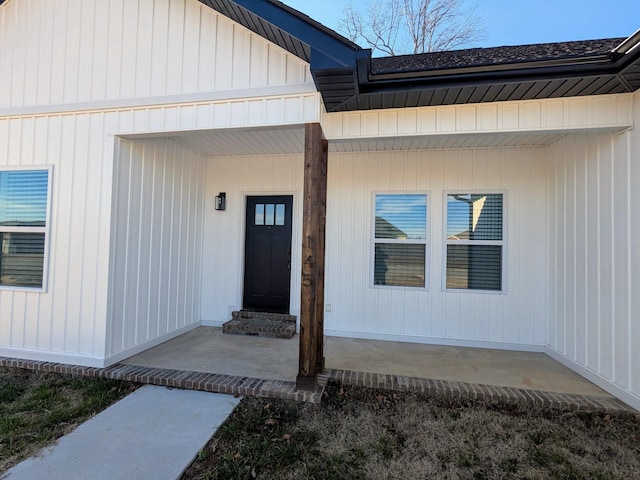 property entrance featuring a patio