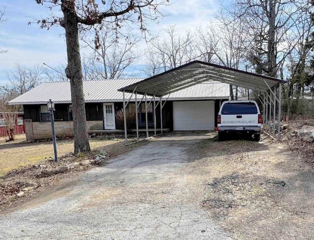 view of front of house featuring a carport and a garage