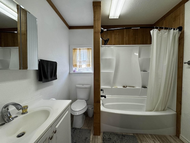 full bathroom featuring toilet, a textured ceiling, vanity, shower / bath combination with curtain, and hardwood / wood-style floors