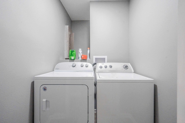 washroom featuring independent washer and dryer