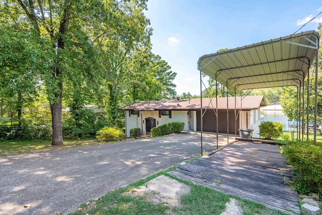 view of front of property featuring a carport