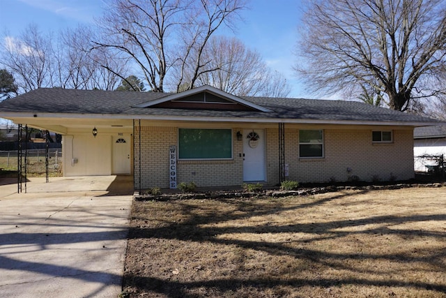 single story home featuring a carport