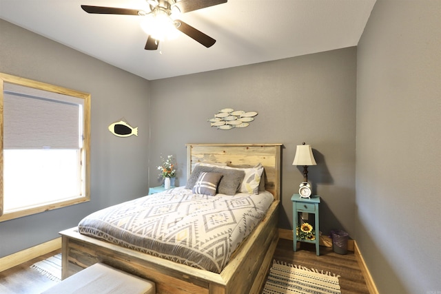 bedroom with hardwood / wood-style floors and ceiling fan