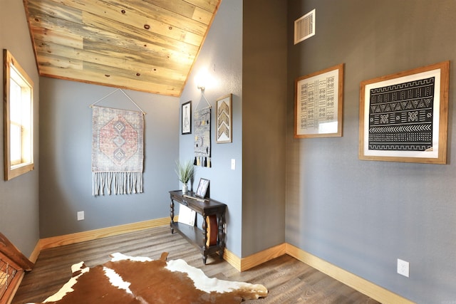 interior space featuring lofted ceiling, wood ceiling, and hardwood / wood-style flooring