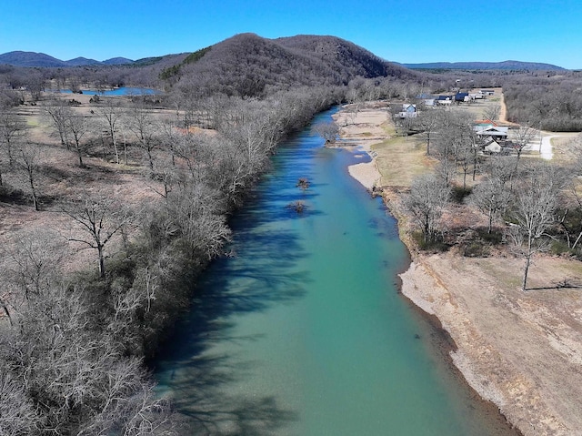 drone / aerial view with a water and mountain view