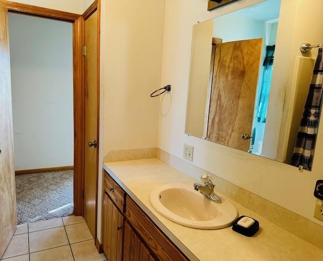 bathroom with tile patterned floors and vanity