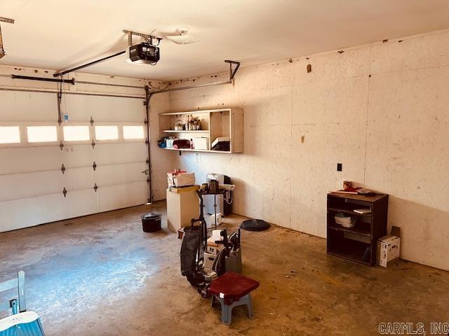 garage featuring a garage door opener