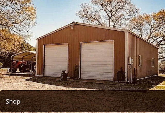 garage featuring a carport