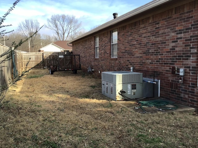 view of yard with central AC unit