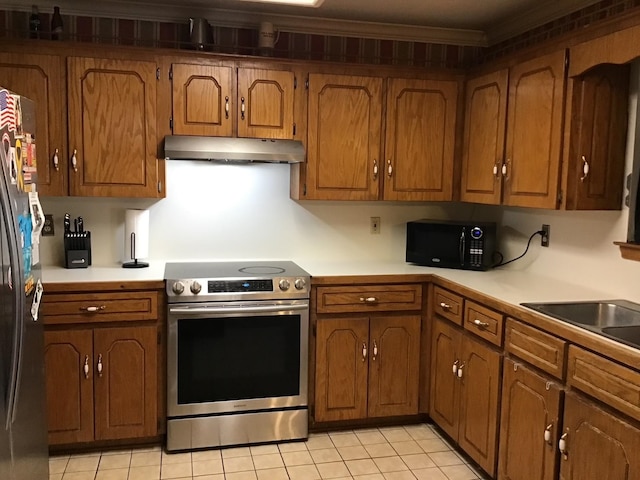 kitchen featuring stainless steel appliances, ornamental molding, sink, and light tile patterned floors