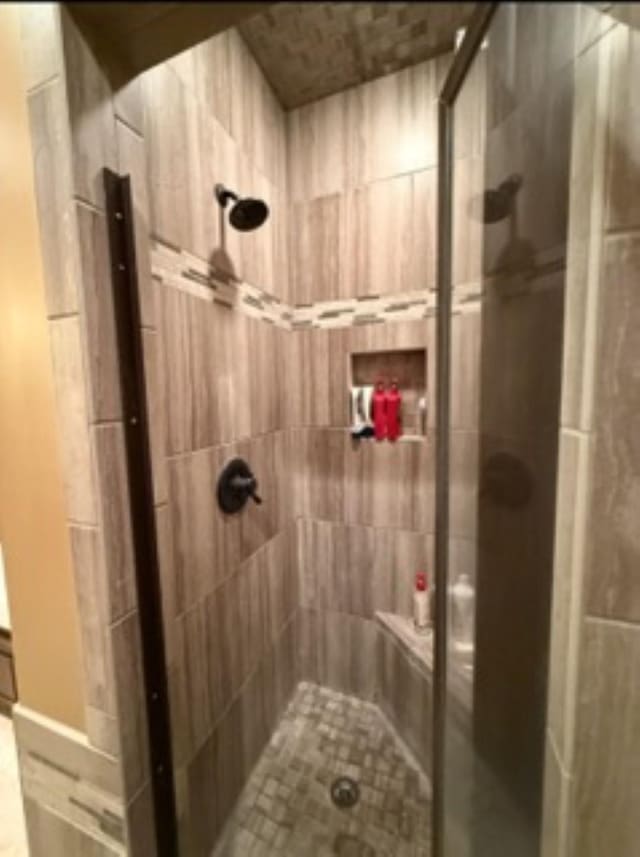 bathroom featuring a shower stall