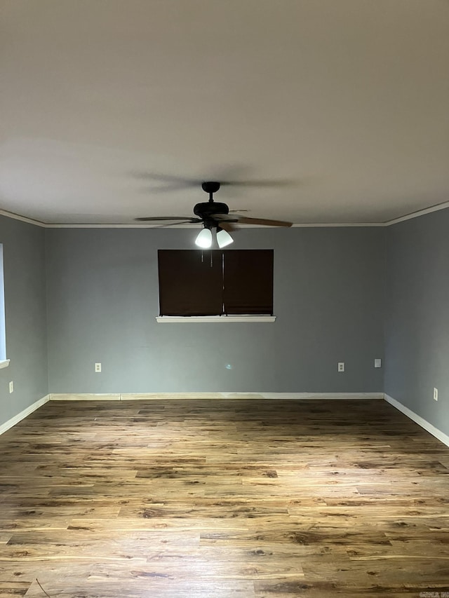 5006 Manor, Little Rock, AR 72204 - spare room featuring wood-type flooring, ornamental molding, and ceiling fan