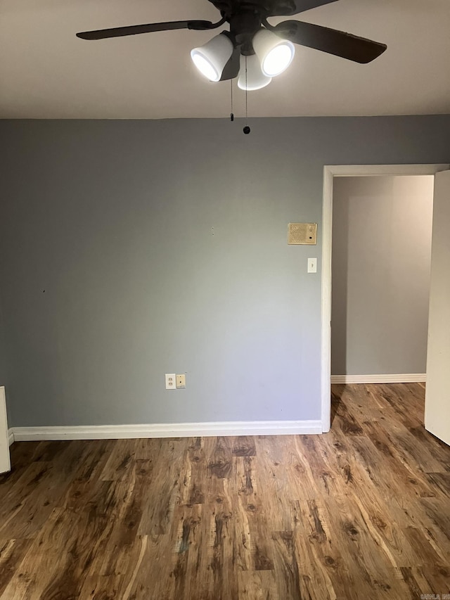 unfurnished room with ceiling fan and wood-type flooring