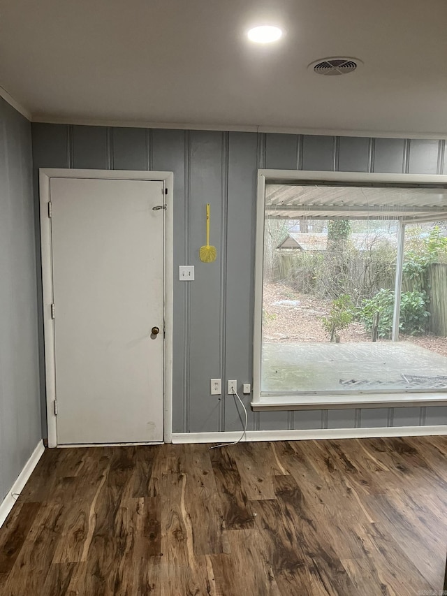 interior space with dark hardwood / wood-style flooring