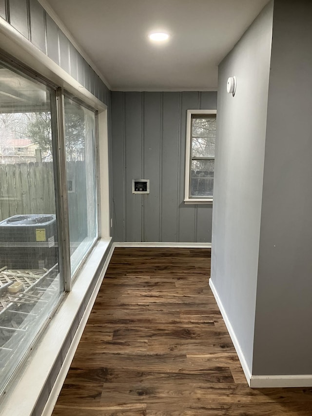 hall with dark hardwood / wood-style floors